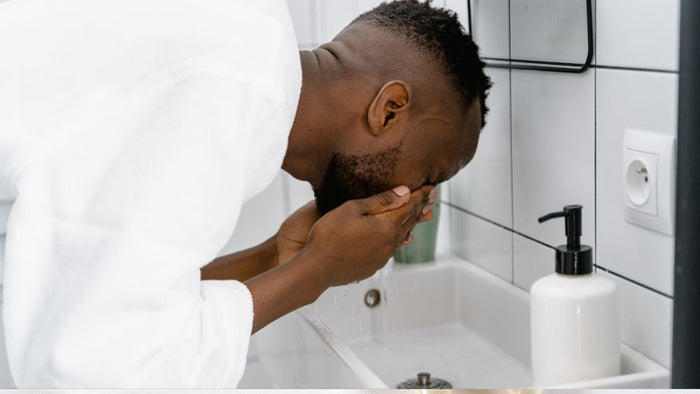 A man washing his beard