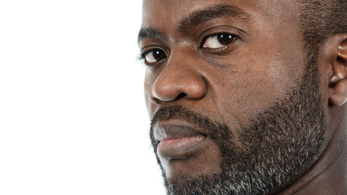 Black man with beard.